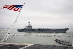 The Nimitz-class aircraft carrier USS Harry S. Truman (CVN 75) departs Naval Station Norfolk as seen from USS Dwight D. Eisenhower (CVN 69). Harry S. Truman is underway conducting operations at sea to reintegrate the carrier strike group and make final preparations to ensure the carrier, air wing, and Sailors are operationally ready to deploy. (U.S. Navy photo by Mass Communication Specialist 3rd Class Kaleb J. Sarten/Released)